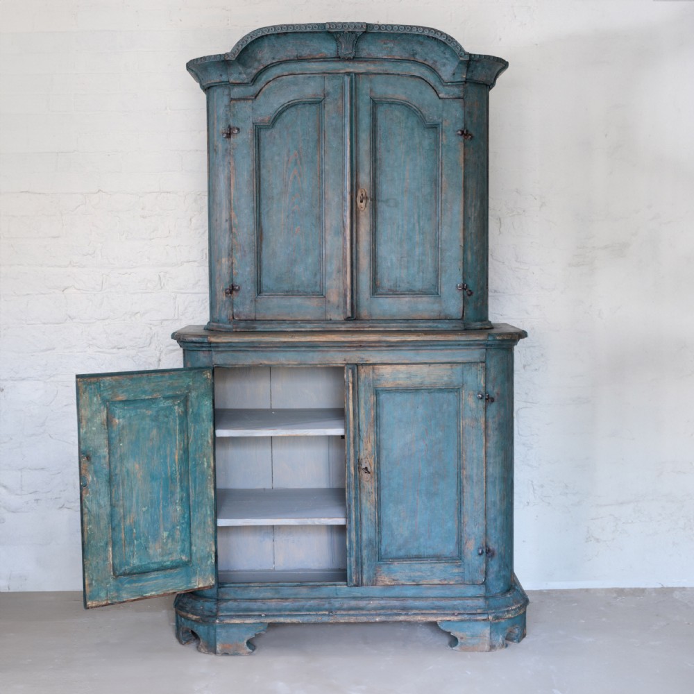 An eighteenth-century French buffet a deux corps with a distressed blue painted finish, arched upper cabinet doors, and iron hardware. View VIII