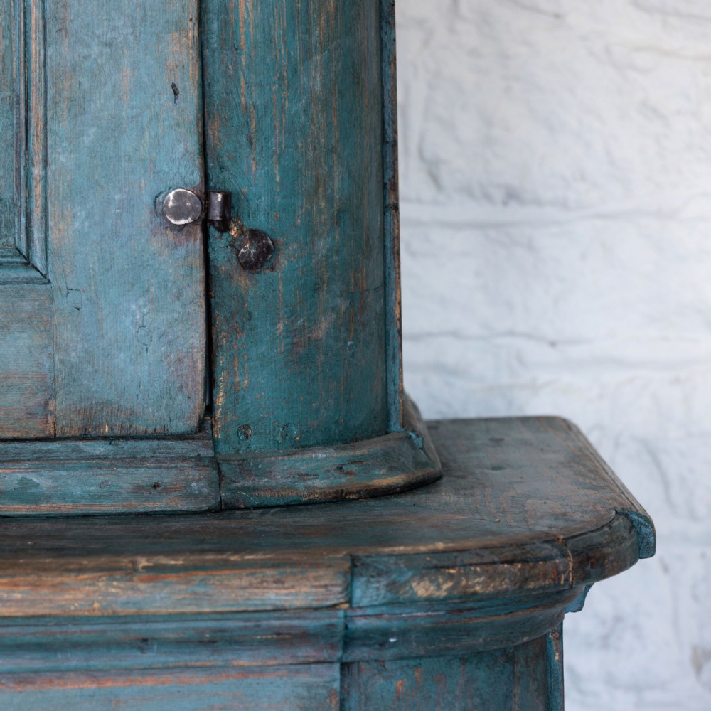 An eighteenth-century French buffet a deux corps with a distressed blue painted finish, arched upper cabinet doors, and iron hardware. View XIV