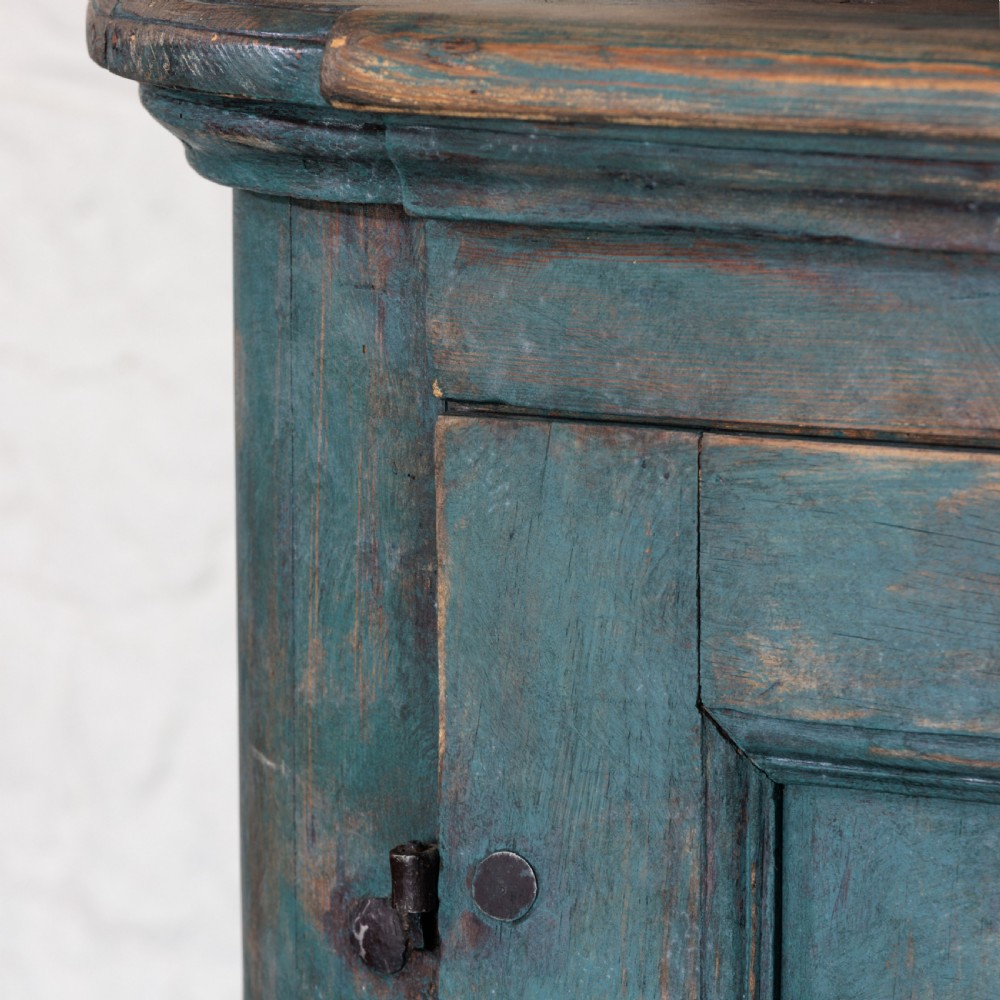 An eighteenth-century French buffet a deux corps with a distressed blue painted finish, arched upper cabinet doors, and iron hardware. View XV