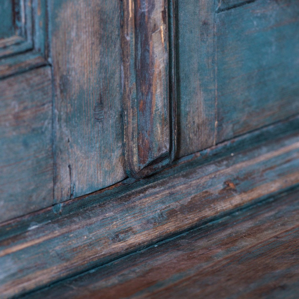 An eighteenth-century French buffet a deux corps with a distressed blue painted finish, arched upper cabinet doors, and iron hardware. View XXV