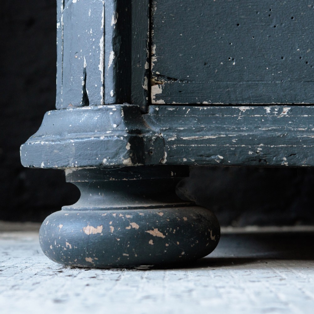 An 18th-century dark green painted serpentine-front chest featuring three drawers and detailed brass keyhole escutcheons. View III
