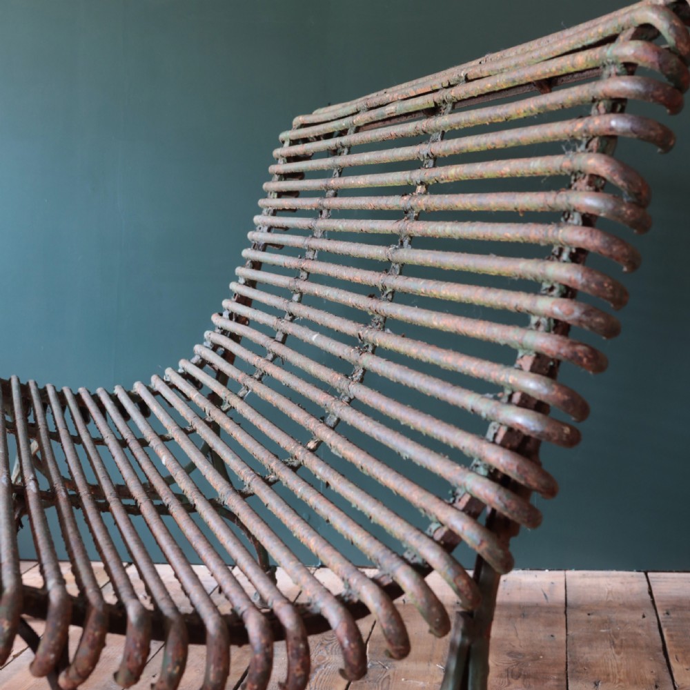 A nineteenth-century French Arras garden bench made of curved green tubular iron slats resting on a riveted iron frame. View III