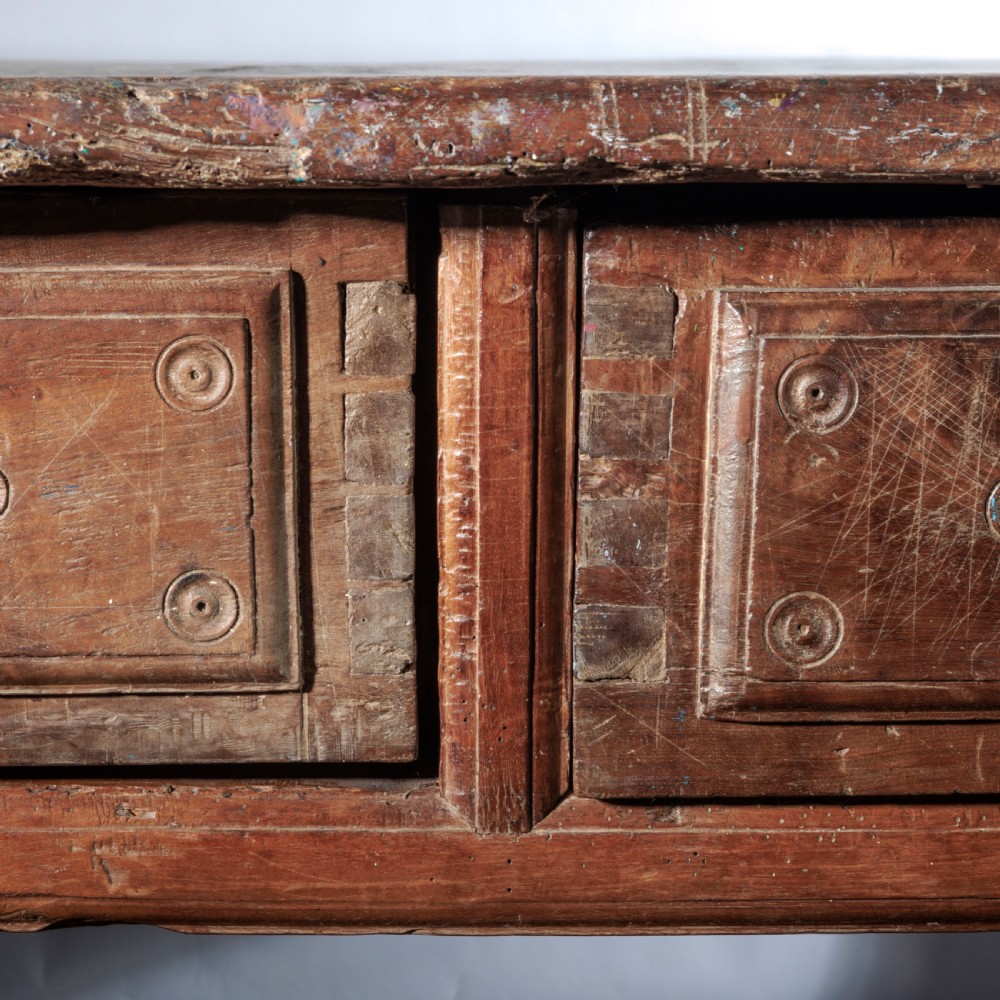 An 18th-century Spanish wooden console table featuring two carved drawer fronts with iron handles and a thick timber top. View VII