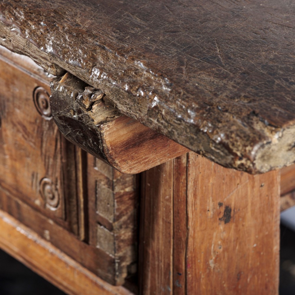 An 18th-century Spanish wooden console table featuring two carved drawer fronts with iron handles and a thick timber top. View XI