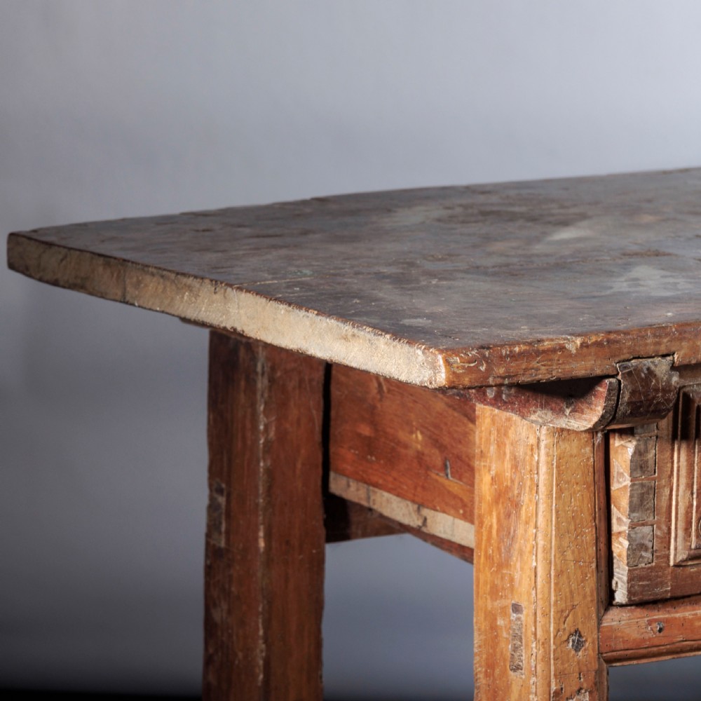 An 18th-century Spanish wooden console table featuring two carved drawer fronts with iron handles and a thick timber top. View XII