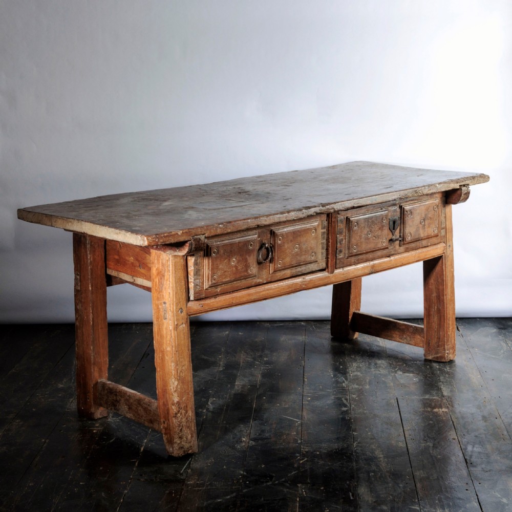 An 18th-century Spanish wooden console table featuring two carved drawer fronts with iron handles and a thick timber top. View XIV