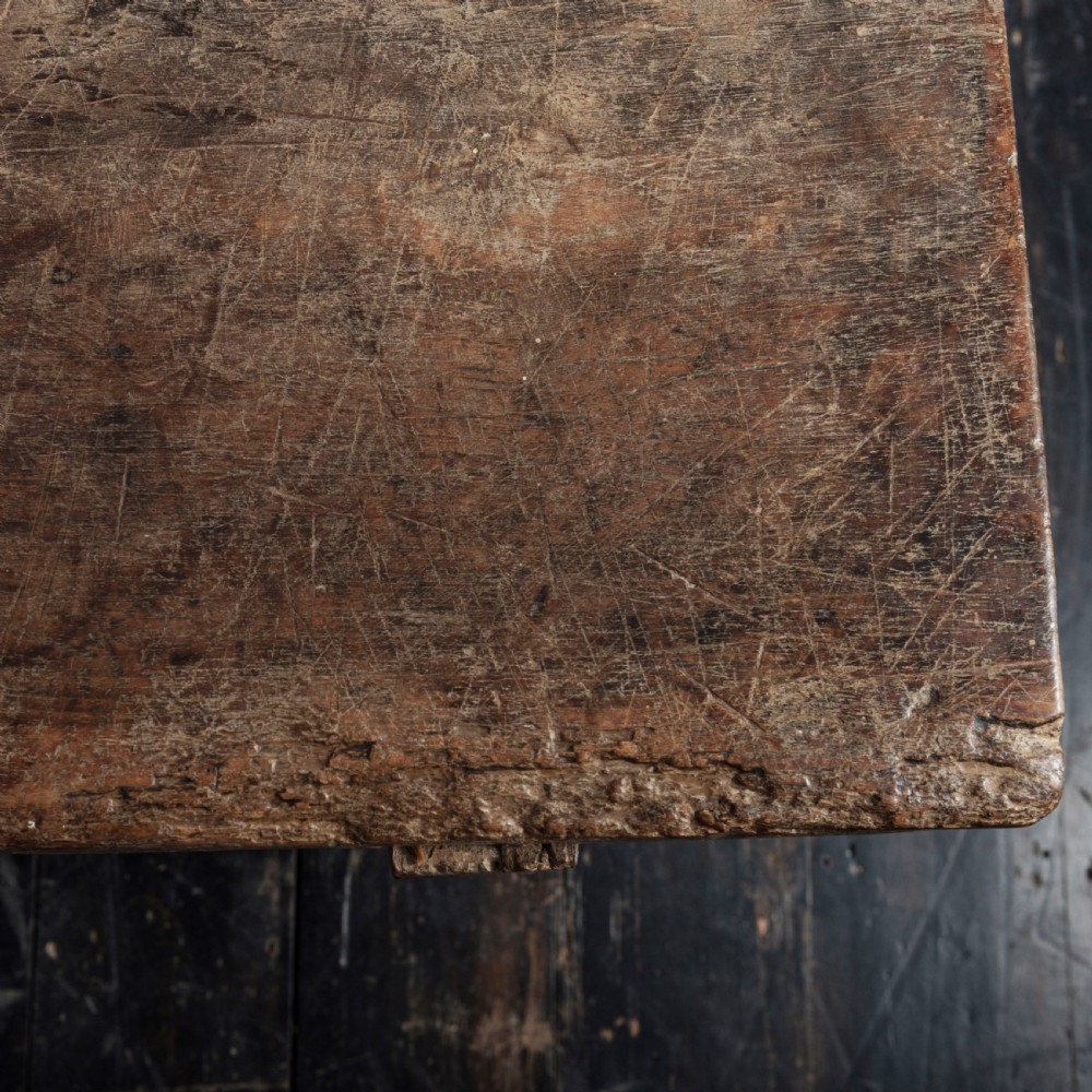 An 18th-century Spanish wooden console table featuring two carved drawer fronts with iron handles and a thick timber top. View XVIII