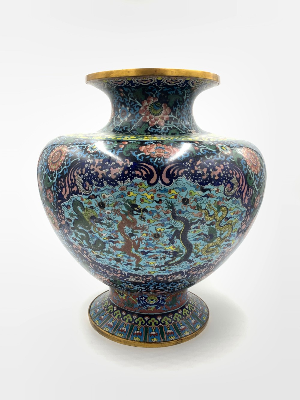 A bulbous 19th-century Chinese cloisonne enamel vase with a flared neck, featuring circular yellow dragon medallions surrounded by dense floral scrollwork on a dark blue ground. View IV