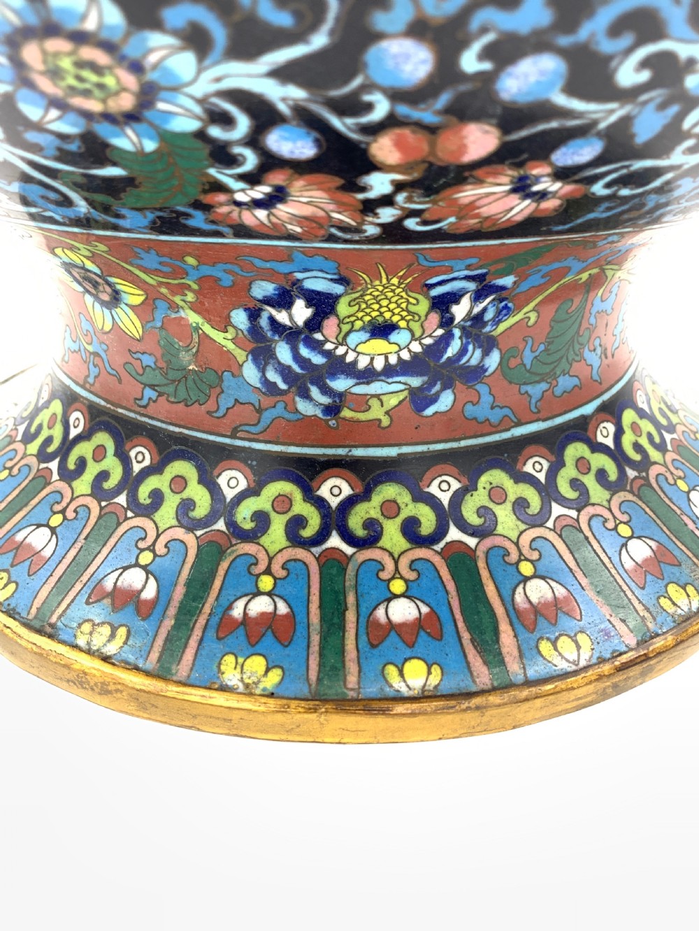 A bulbous 19th-century Chinese cloisonne enamel vase with a flared neck, featuring circular yellow dragon medallions surrounded by dense floral scrollwork on a dark blue ground. View VII