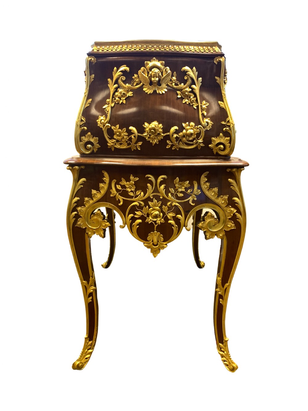 A 19th-century dark wood writing desk featuring elaborate gilt-bronze floral ormolu mounts, cabriole legs, and an asymmetrical raised side superstructure. View III