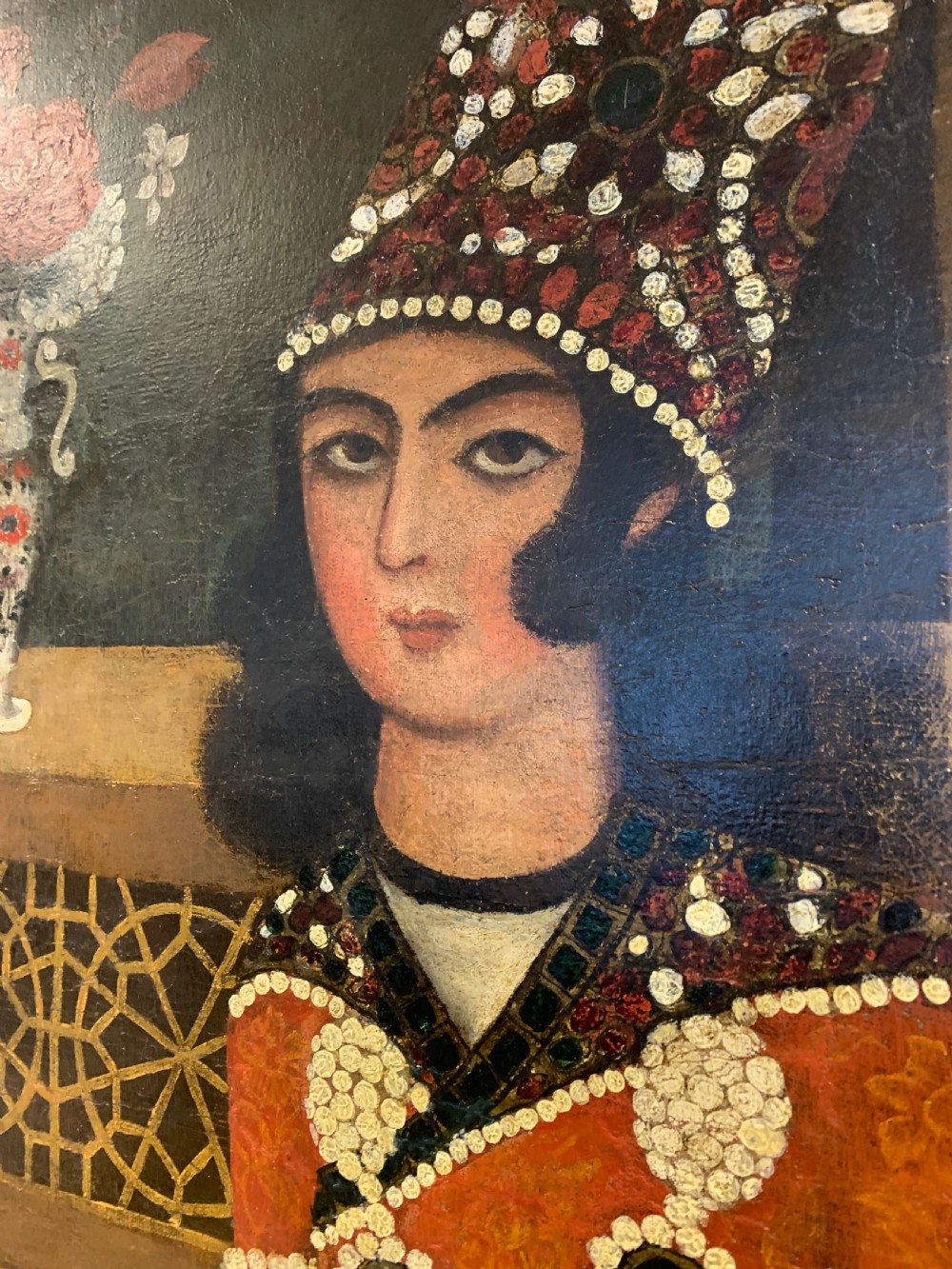 An arched 19th-century Persian Qajar dynasty painting featuring a bearded sage seated alongside a young pupil and an attendant in courtly attire. View II