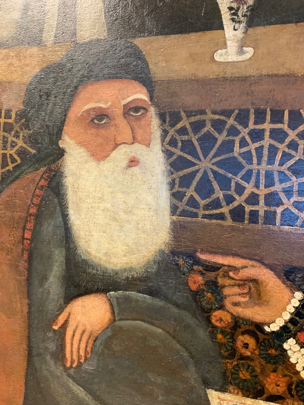An arched 19th-century Persian Qajar dynasty painting featuring a bearded sage seated alongside a young pupil and an attendant in courtly attire. View III