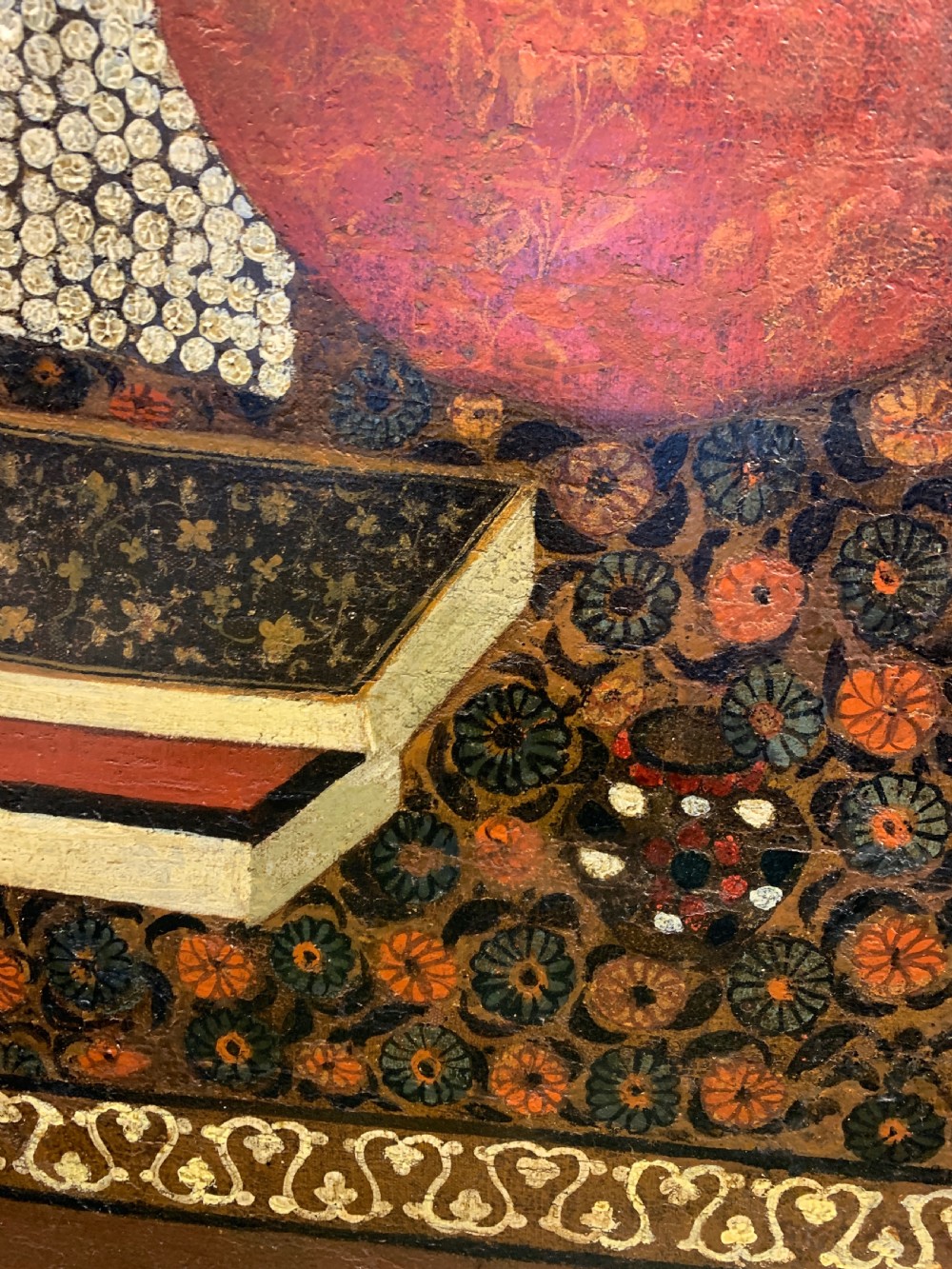 An arched 19th-century Persian Qajar dynasty painting featuring a bearded sage seated alongside a young pupil and an attendant in courtly attire. View V
