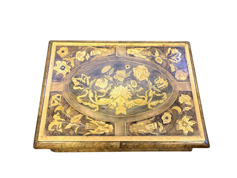 A rectangular seventeenth-century style wooden box featuring intricate floral marquetry inlays on the lid and front, set within moulded borders. View IV