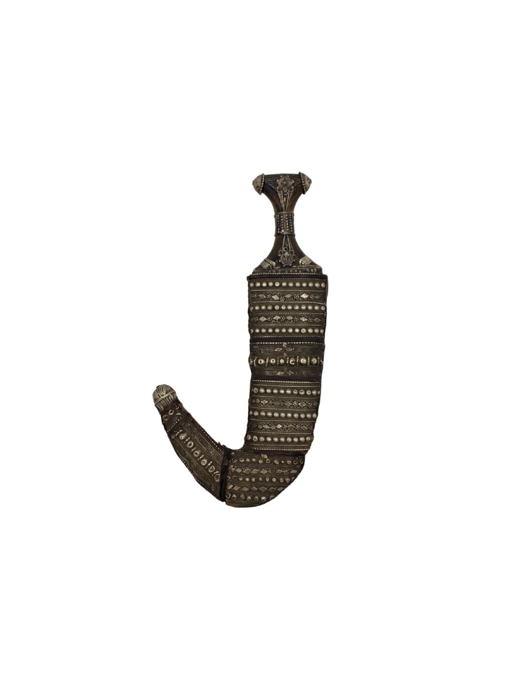 A curved Yemeni jambiya dagger in an intricately decorated silver sheath with a matching silver-mounted hilt.