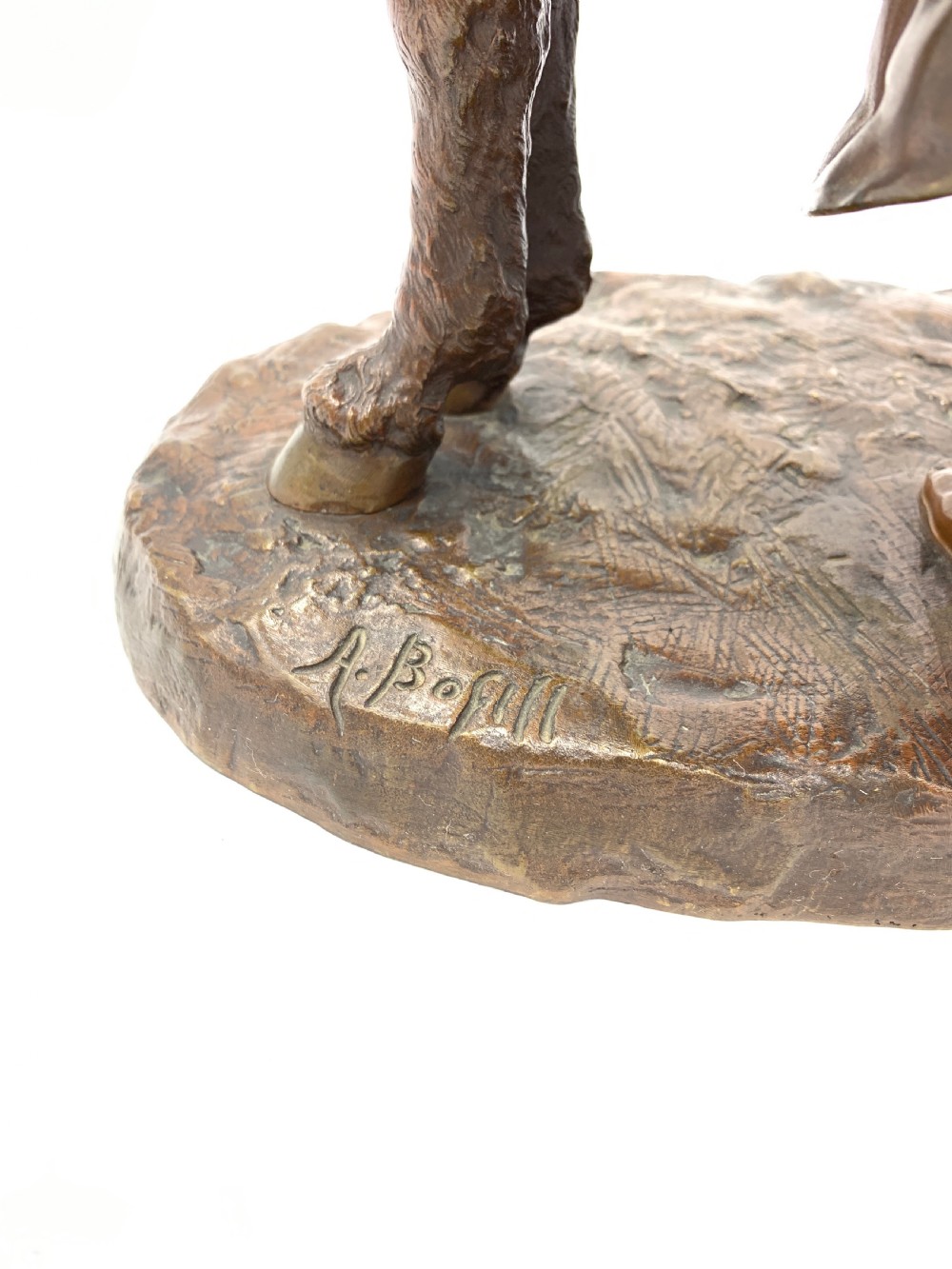A dark patinated bronze sculpture featuring a man in traditional North African attire leaning against a saddled donkey on a naturalistic base with a title plaque. View VII