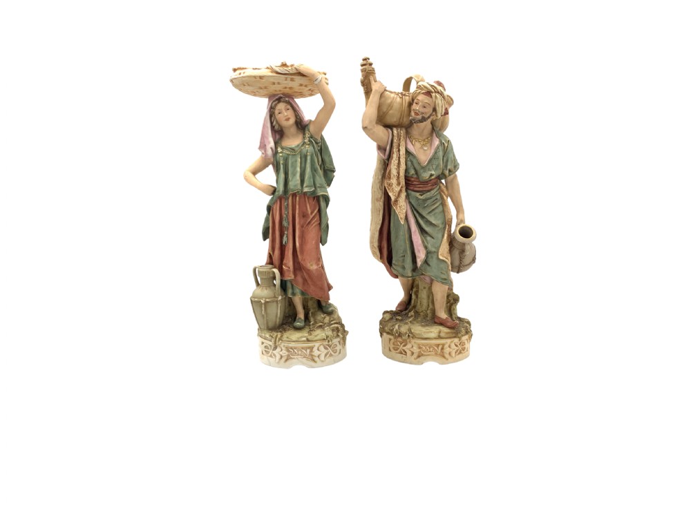 PAIR OF ROYAL DUX BOHEMIA PORCELAIN FIGURES OF AN EASTERN WATER BEARER AND HIS COMPANION 