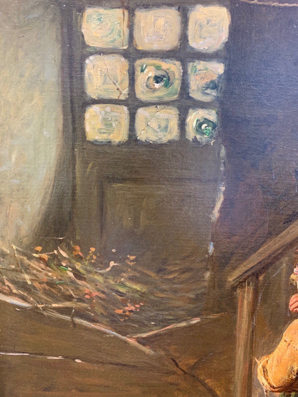 An antique oil painting depicting a mother and two children in a rustic interior, enclosed within an ornate gilded frame. View VII