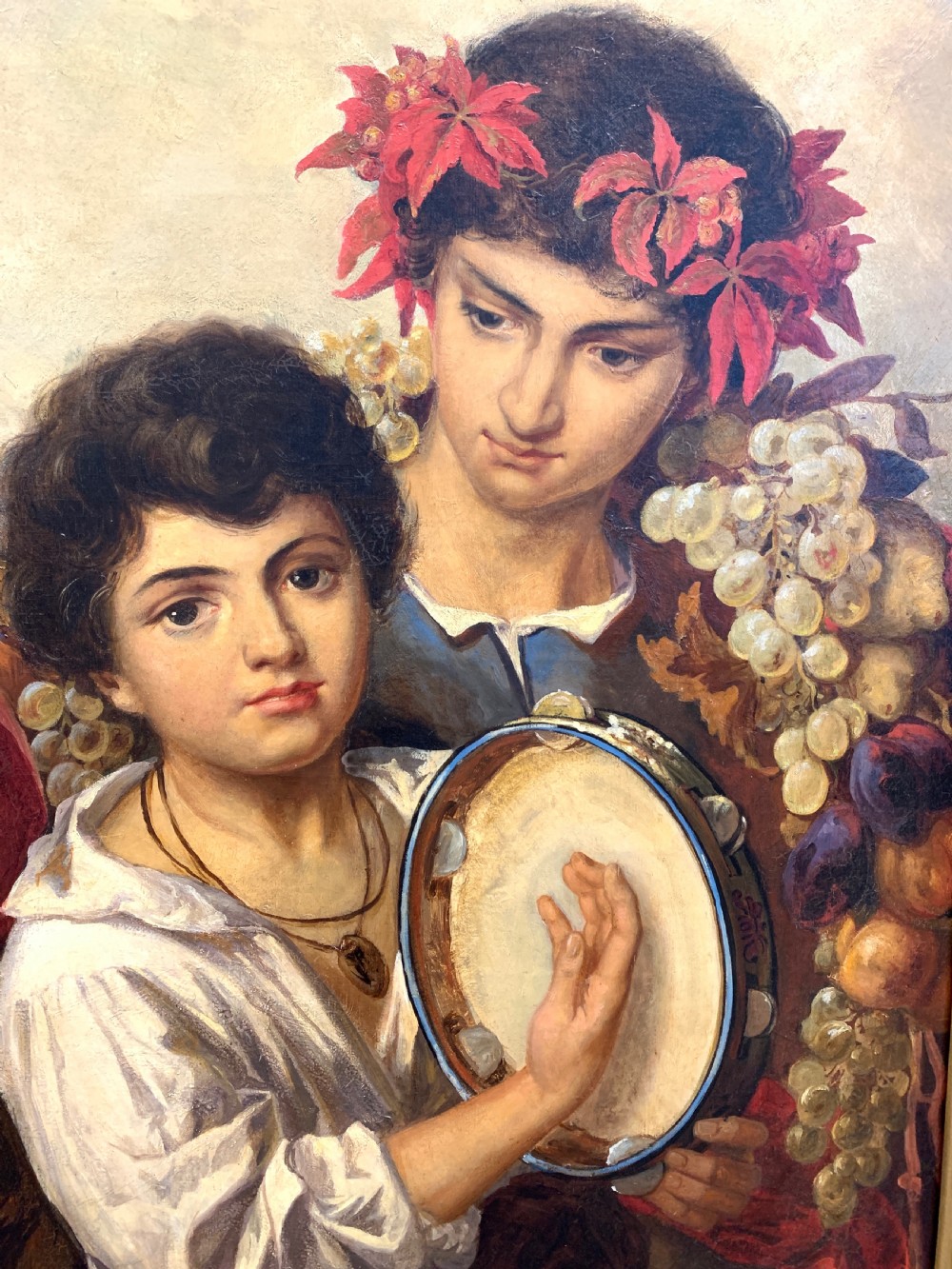 A 19th-century oil painting on canvas depicting a classical grape harvest celebration with multiple figures, presented in an elaborate gilded wood frame. View V
