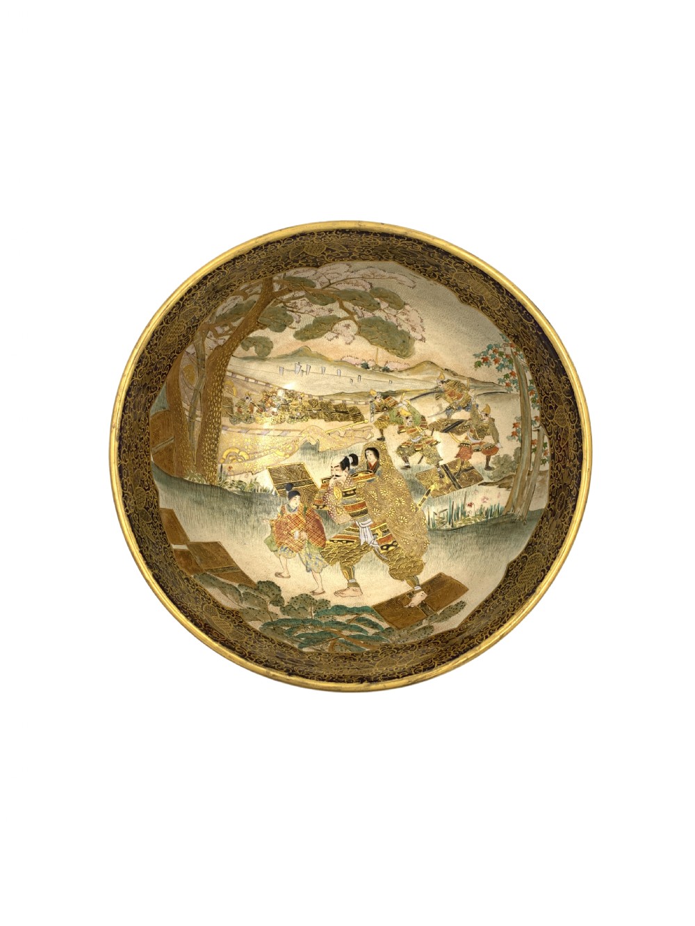 A deep circular Japanese Satsuma earthenware bowl with detailed hand-painted figural scenes, dense gilt borders, and a crackle glaze. View II