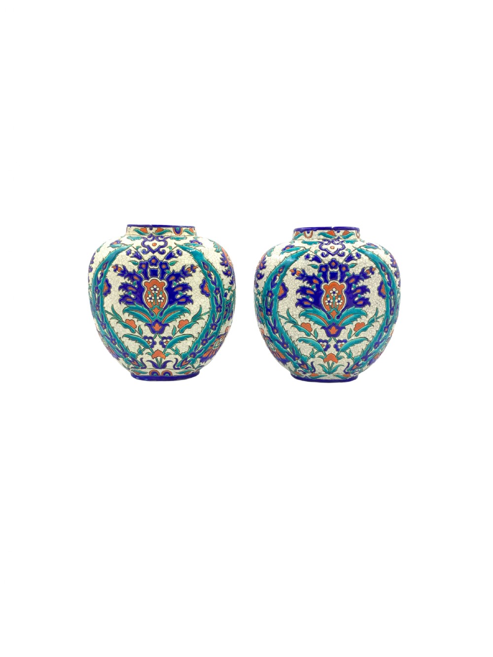 A pair of round ceramic vases decorated with Iznik-style blue, turquoise, and orange floral motifs over a crackled white glaze.