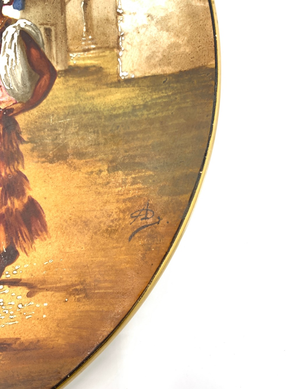 A circular 19th-century French porcelain plate decorated with a hand-painted Orientalist scene depicting an Arab horseman on a dark horse accompanied by a attendant in a sunny courtyard. View V