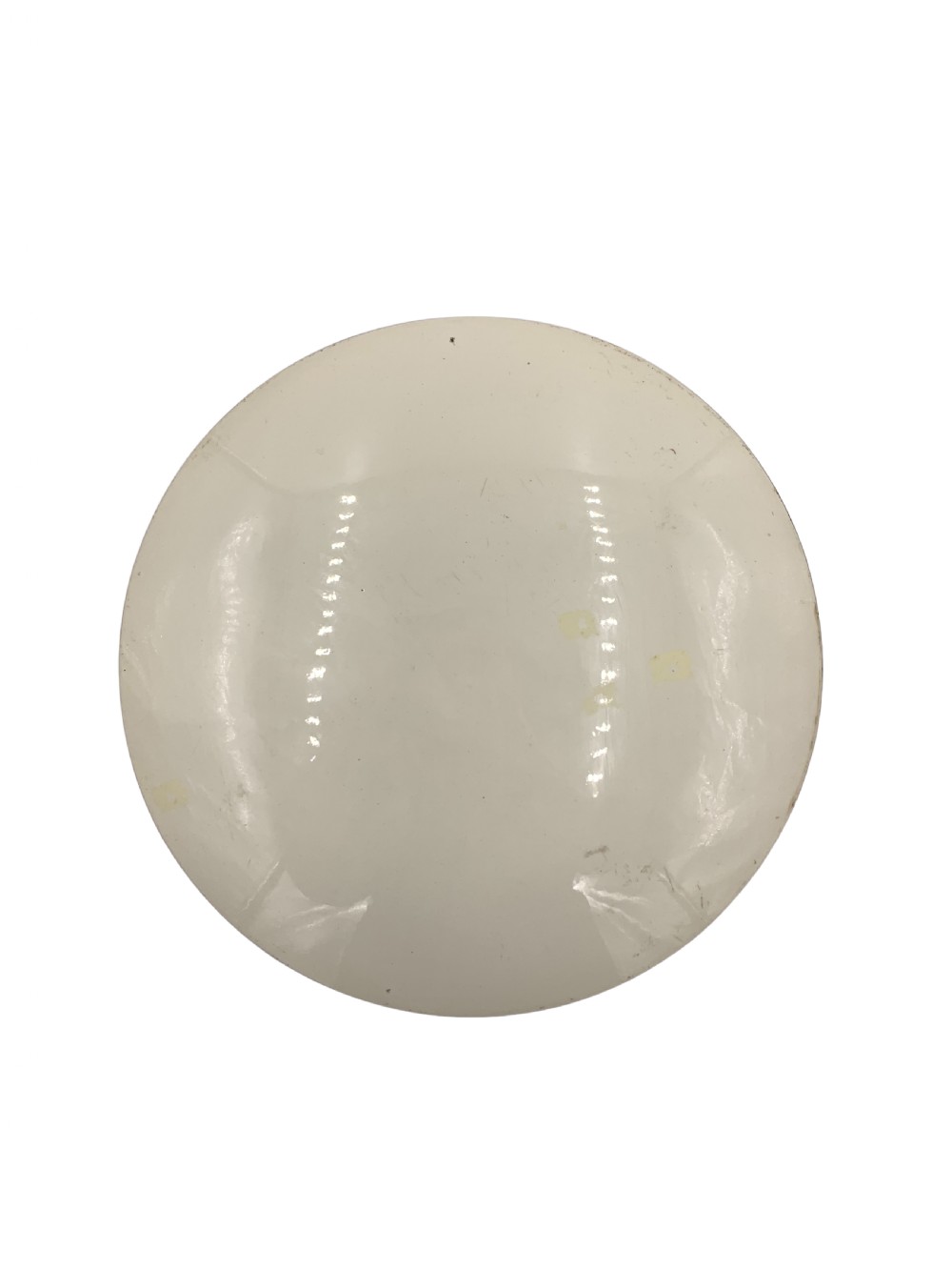 A circular 19th-century French porcelain plate decorated with a hand-painted Orientalist scene depicting an Arab horseman on a dark horse accompanied by a attendant in a sunny courtyard. View VIII