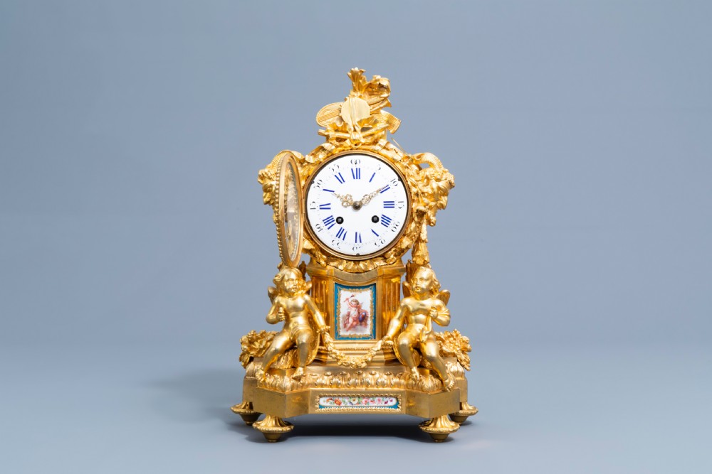 A GILT BRONZE SÈVRES STYLE CLOCK SET, LOUIS XV STYLE, FRANCE, 19TH CENTURY  View IV