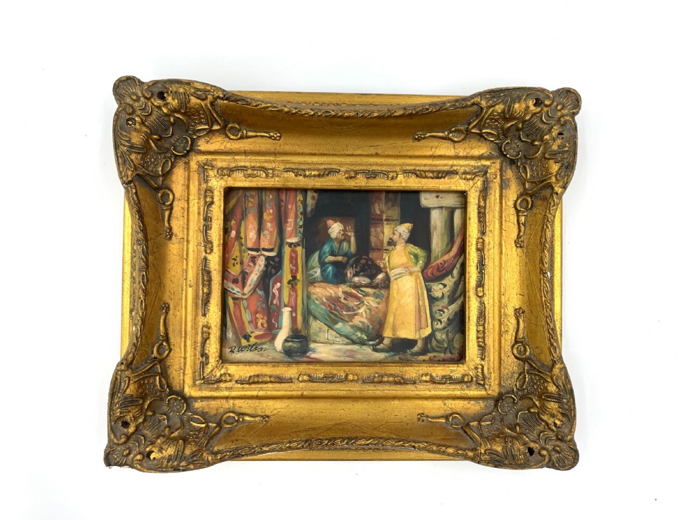 A pair of framed Orientalist oil paintings on board in heavily ornamented gold gilt frames, depicting Middle Eastern figures indoors and riders watering horses outdoors. View III