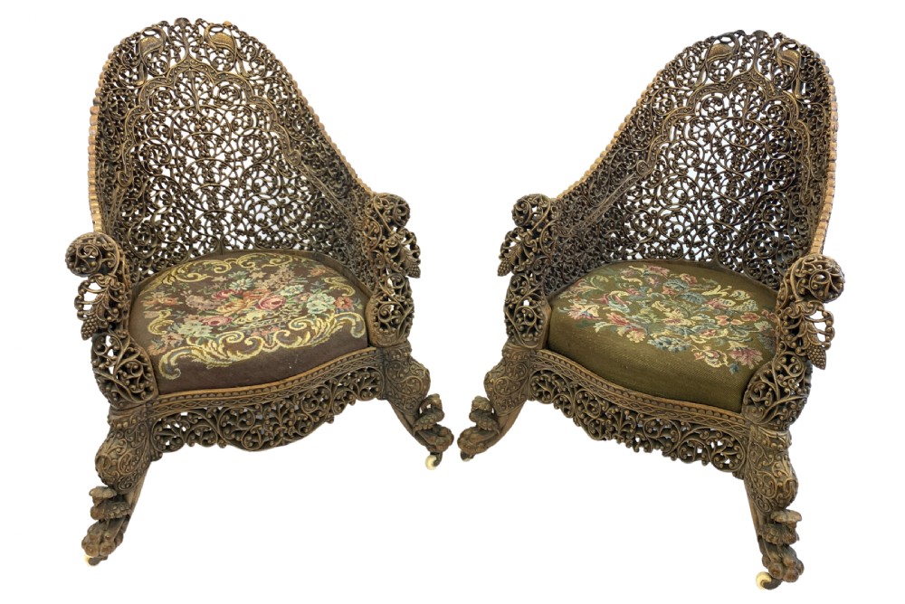 PAIR OF CARVED HARDWOOD ANGLO INDIAN ARM CHAIRS FROM THE BOMBAY PRESIDENCY, 19TH CENTURY 