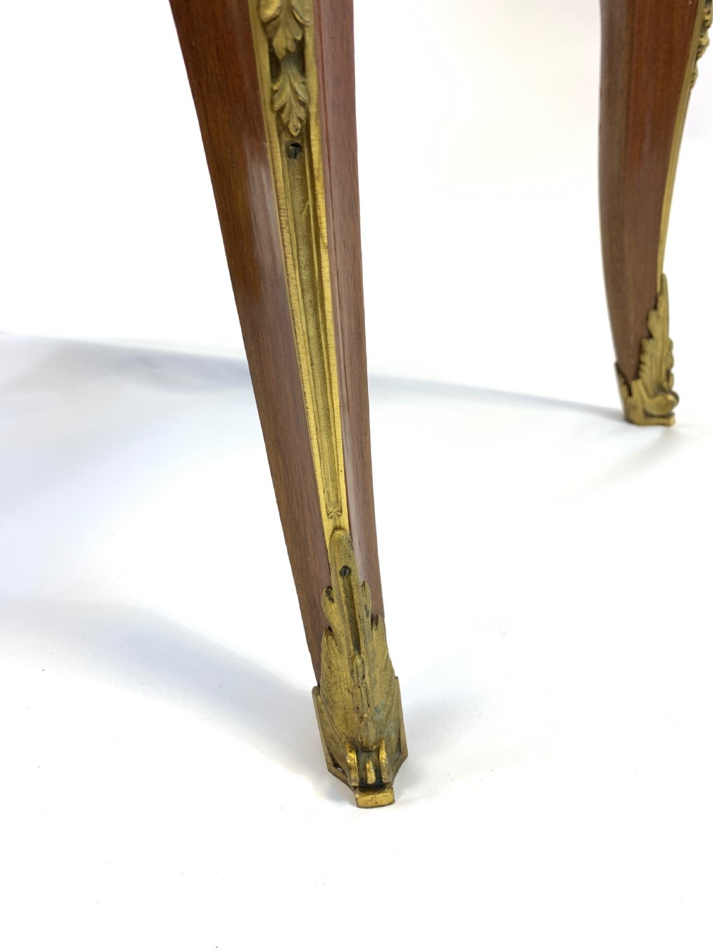 A 19th-century French Louis XVI style mahogany vitrine cabinet featuring glass side panels, gilt bronze mounts, a parquetry lower section, and a marble top. View VII