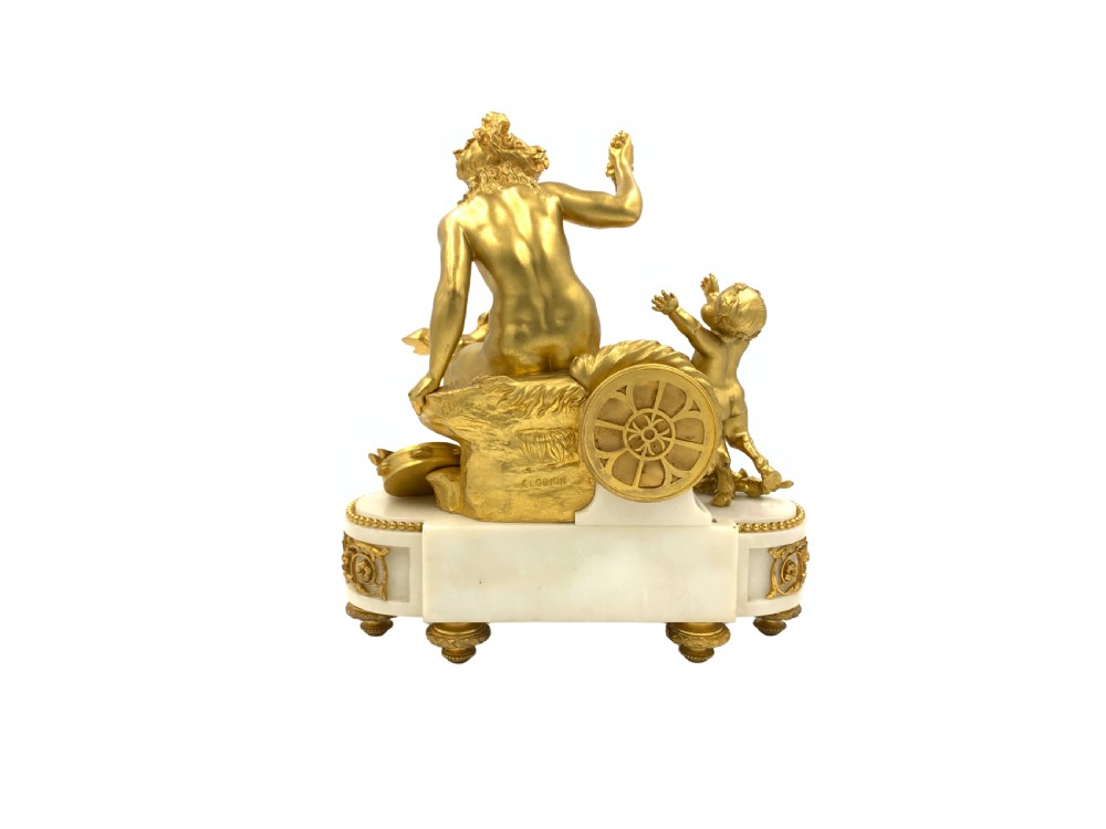 A late nineteenth-century French Louis XVI style gilt-bronze and white marble mantel clock featuring a sculptural bacchante figure alongside an enamel dial. View III
