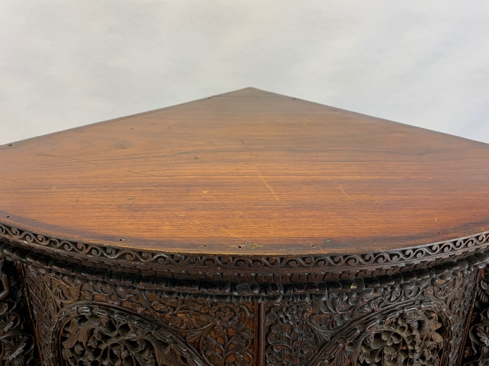 HEAVILY CARVED ANGLO INDIAN CORNER CABINET, 19TH CENTURY   View XIII