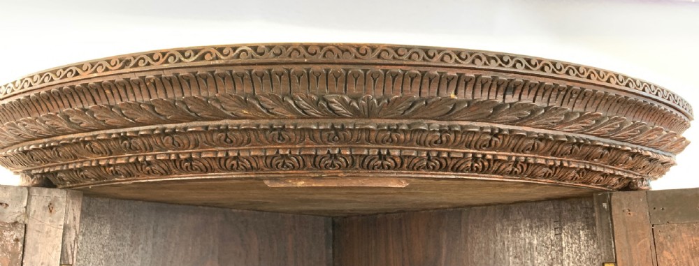 HEAVILY CARVED ANGLO INDIAN CORNER CABINET, 19TH CENTURY   View XV