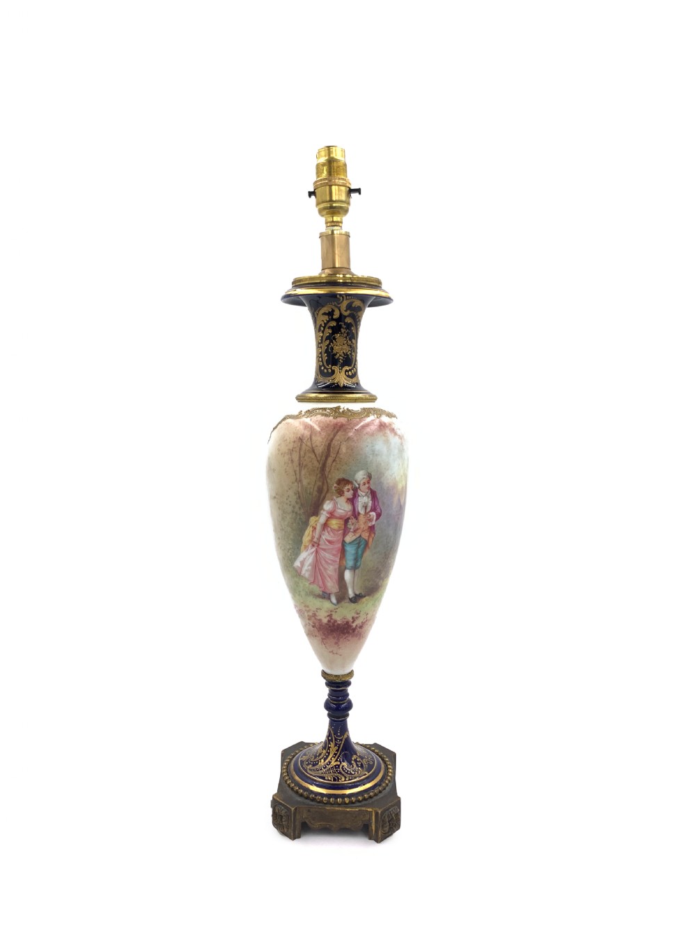 A 19th-century French Sevres style porcelain urn table lamp featuring hand-painted figures, cobalt blue accents, gilt detail, and a pleated silk shade. View II