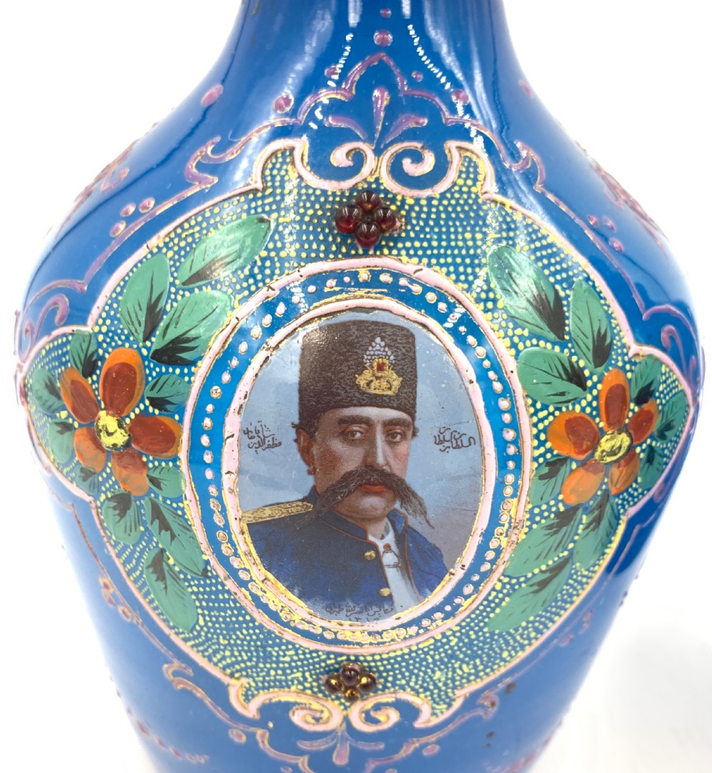 A PAIR OF ROYAL BLUE OPAQUE JEWELLED AND ENAMELLED BOHEMIAN GLASS HOOKAH BASES WITH PORTRAITS OF SULTAN MOZAFFAR AL-DIN SHAH QAJAR DATED 1315 HIJRI  View IV
