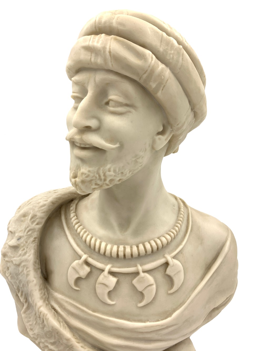 A pair of carved off-white marble busts depicting a man and woman in detailed Orientalist dress and headwear on integral square bases. View VII