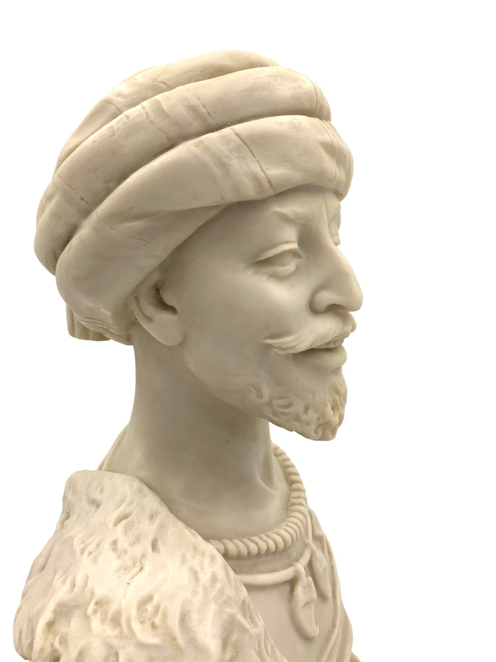 A pair of carved off-white marble busts depicting a man and woman in detailed Orientalist dress and headwear on integral square bases. View VIII