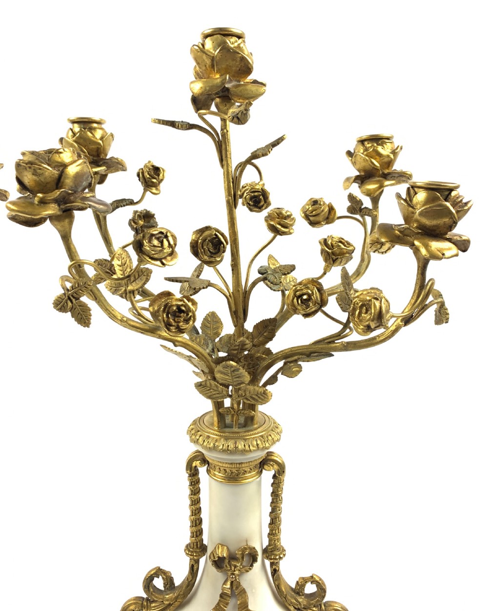 A pair of French Louis XVI style white marble urn candelabra with gilt-bronze rose foliage branches and ribbon mounts. View IV