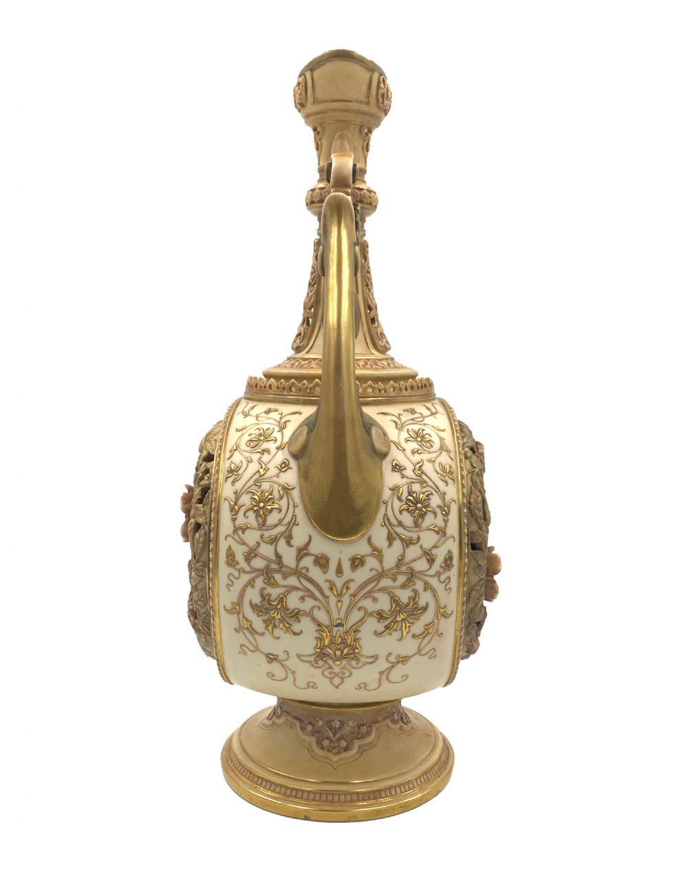 A late 19th-century Royal Worcester porcelain vase featuring twin handles, pierced reticulated panels, gilt accenting, and relief floral decoration on a blush ivory surface. View III