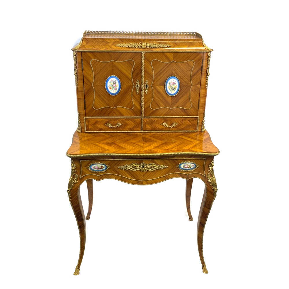 A late 19th-century French kingwood bonheur du jour featuring parquetry veneers, gilt-bronze mounts, oval porcelain plaques, and curved cabriole legs. View II