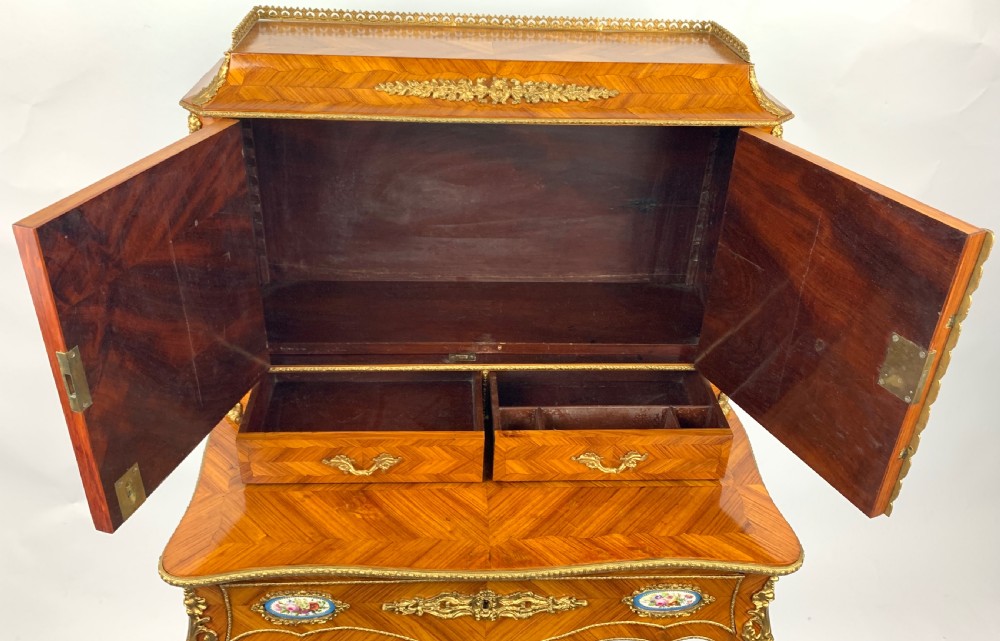 A late 19th-century French kingwood bonheur du jour featuring parquetry veneers, gilt-bronze mounts, oval porcelain plaques, and curved cabriole legs. View VIII