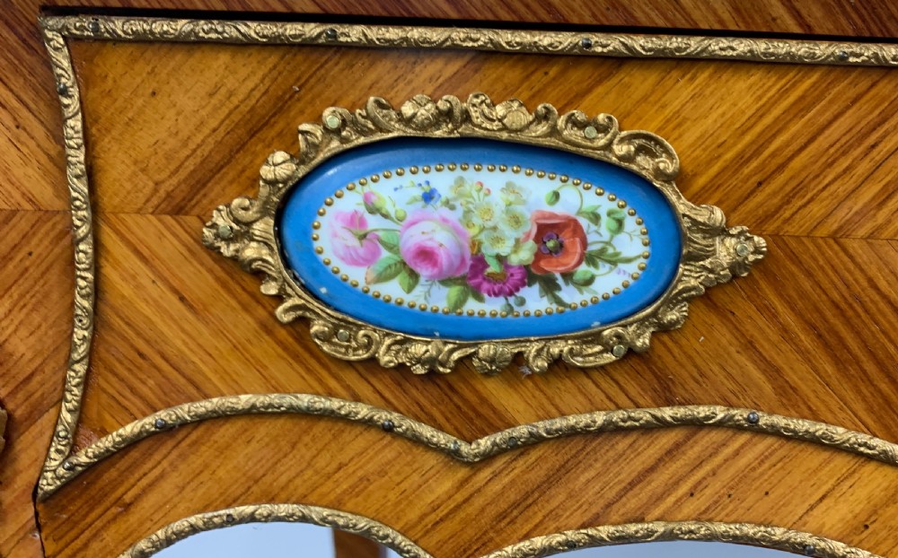 A late 19th-century French kingwood bonheur du jour featuring parquetry veneers, gilt-bronze mounts, oval porcelain plaques, and curved cabriole legs. View XII