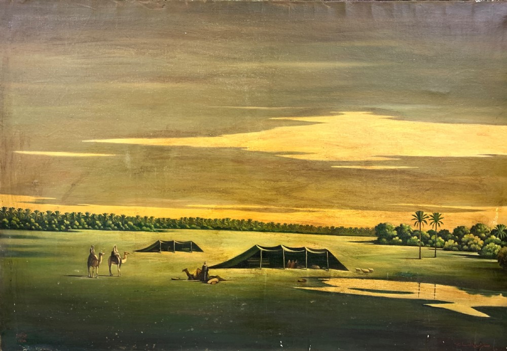 An oil painting on canvas depicting a desert landscape with camels, Bedouin tents, and palm trees under a golden sky, set within a gilded frame. View II