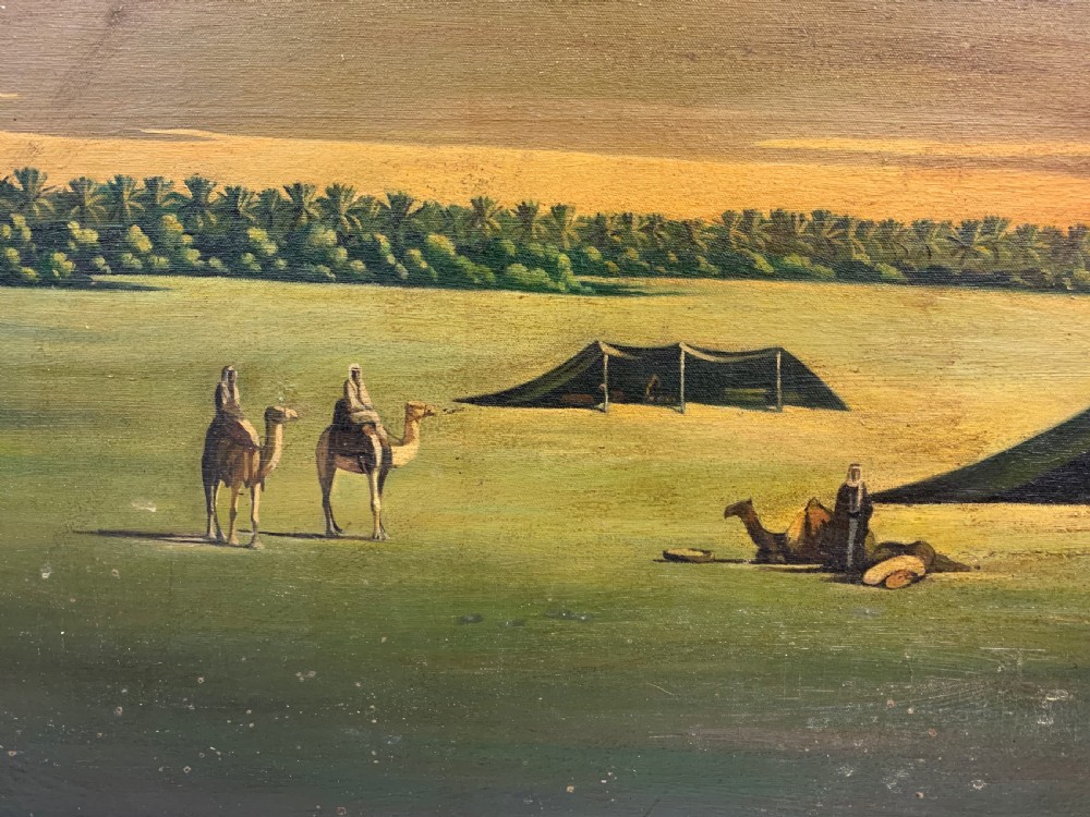 An oil painting on canvas depicting a desert landscape with camels, Bedouin tents, and palm trees under a golden sky, set within a gilded frame. View III