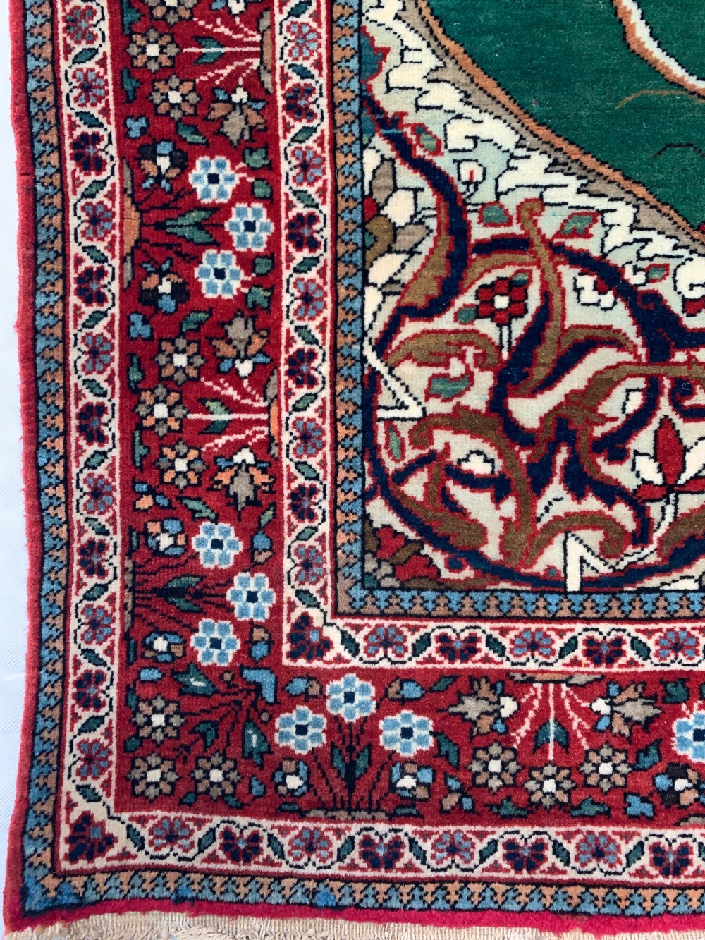A hand-knotted antique Persian pictorial rug depicting Tsar Nicholas II of Russia in military uniform, framed by a cream archway and a dark red floral border with Persian script. View V