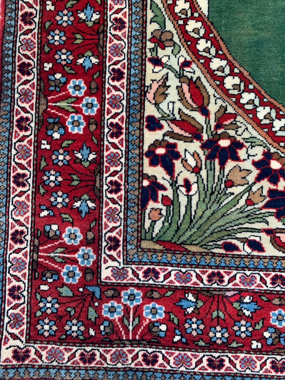 An antique Persian Mohtasham Kashan pictorial rug depicting Kaiser Wilhelm II in a military uniform within a oval medallion and floral borders. View VI