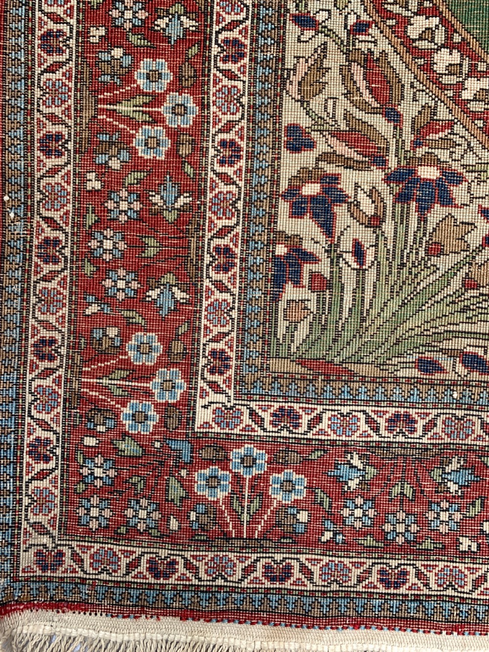 An antique Persian Mohtasham Kashan pictorial rug depicting Kaiser Wilhelm II in a military uniform within a oval medallion and floral borders. View VII