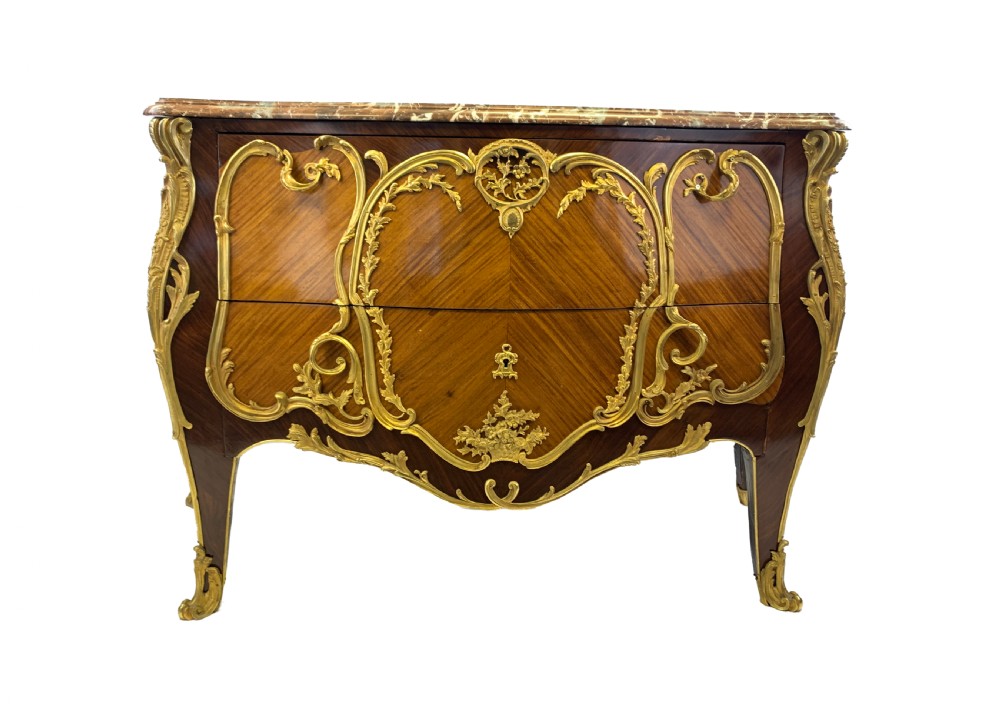 A French Louis XV style bombe commode featuring rich kingwood parquetry veneers, ornate gilt-bronze ormolu mounts, cabriole legs, and a shaped variegated marble top. View II