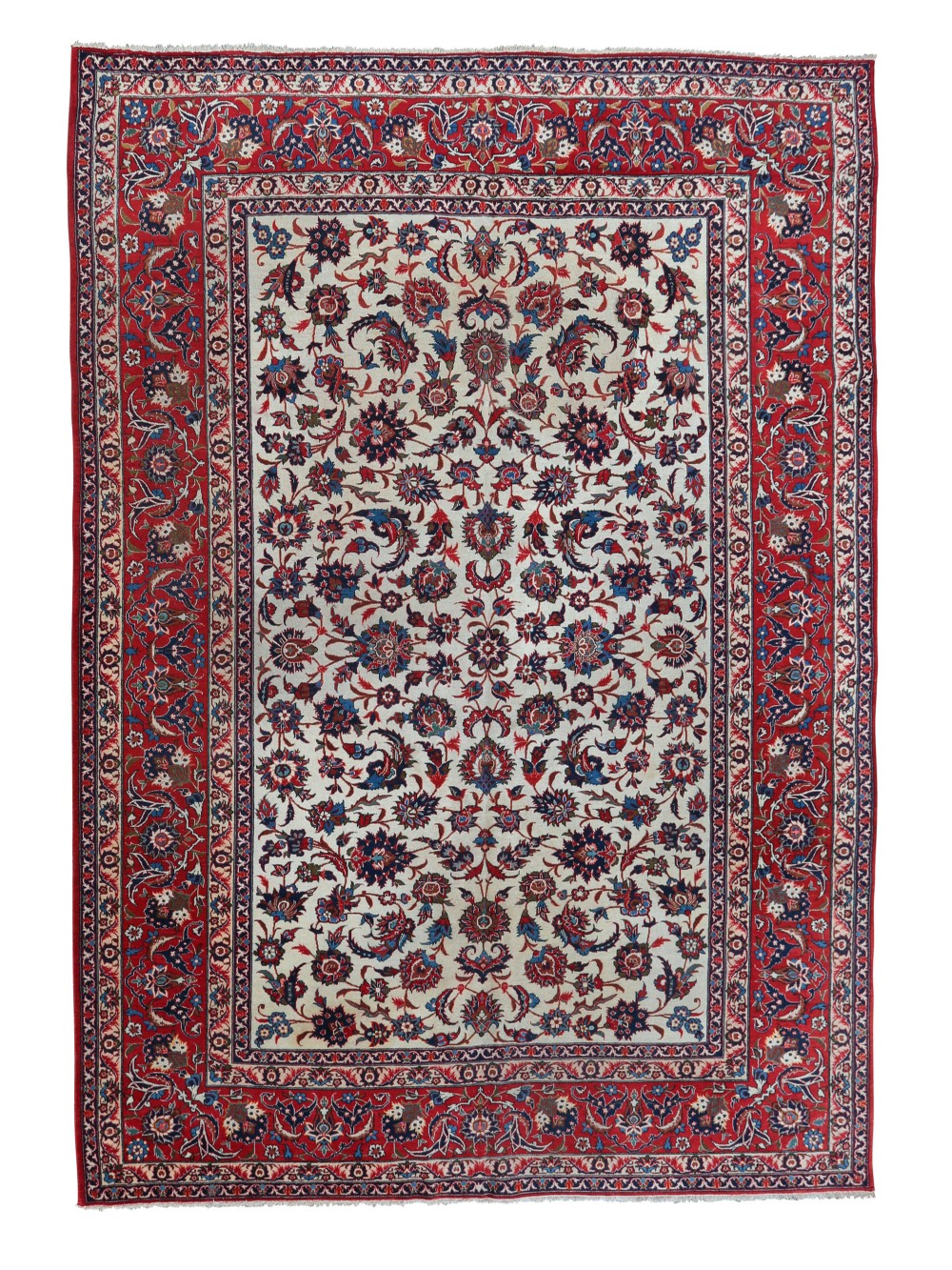 A large hand-knotted Persian Isfahan carpet featuring a cream field filled with intricate floral arabesque patterns framed by a detailed red and navy border.